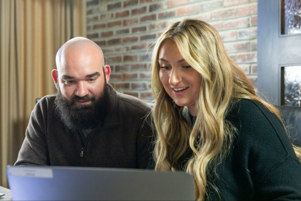 Two people speaking in a warehouse