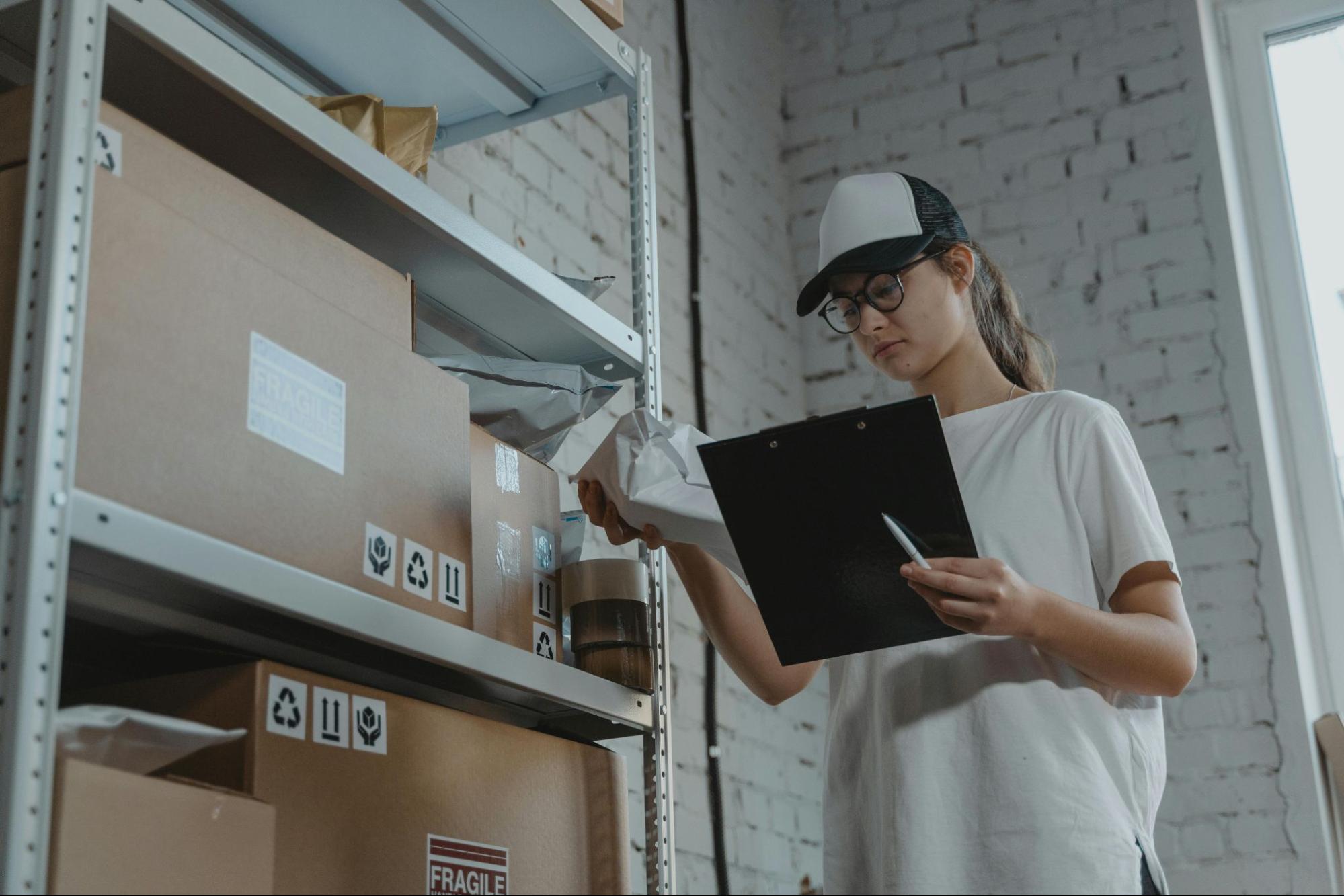 Woman in a stock room counting inventory